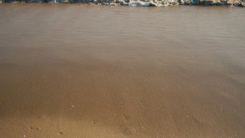 Waves calmly washing on sandy beach. Stock Footage 119122536