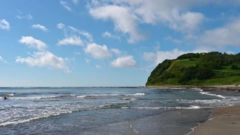 Waves caress the beach at Kunashir Island in the Kuril archipelago Video stock 326126033