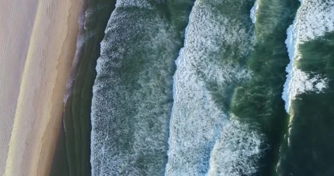 Waves caress ocean edge, an empty beach in am oceanic coast tranquility of .. Stock Footage 294606127