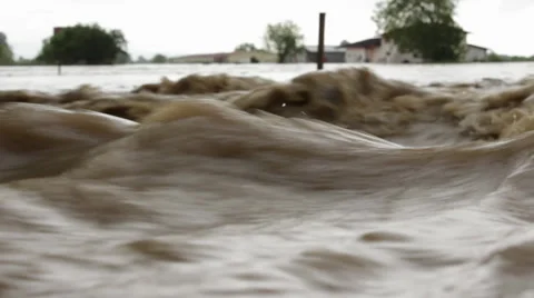 Waves close up. Flood river destroyed agricultural field after big rain storm. Stock Footage 38863125