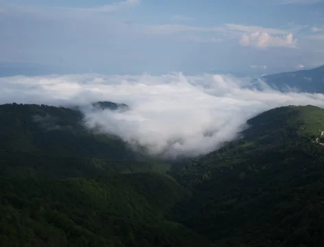 Waves of Clouds covering the mountain - timelapse 4k Stock Footage 53946378