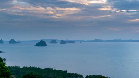 Waves, clouds during sunset sunrise, limestone rock islands in Krabi, Thailand. Stock Footage 249939610