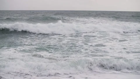 Waves on a cloudy day in the ocean Stock Footage 198399094