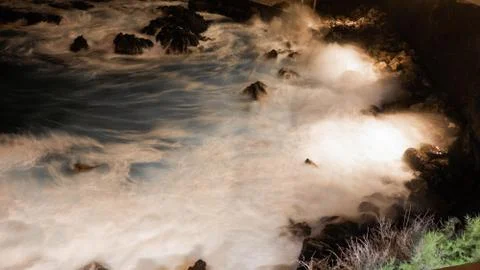 Waves on coast by night Stock Photos