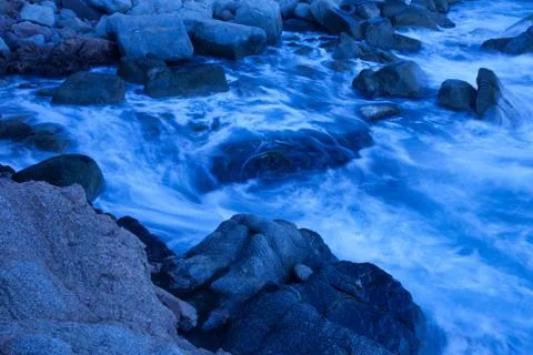 Waves on coastal rocks Stock Photos