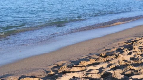Waves of the coastline on the sandy beach of the Mediterranean Sea, Sunset Stock Footage 240626766