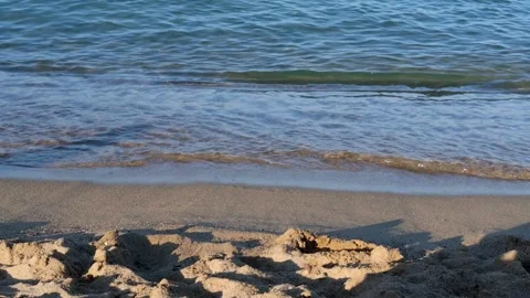 Waves of the coastline on the sandy beach of the Mediterranean Sea, Sunset Stock Footage 240626818