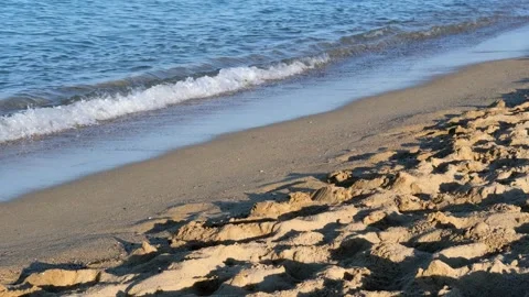 Waves of the coastline on the sandy beach of the Mediterranean Sea. Stock Footage 240726790