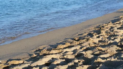 Waves of the coastline on the sandy beach of the Mediterranean Sea. Stock Footage 243708583