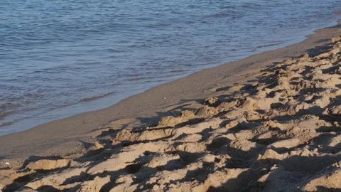 Waves of the coastline on the sandy beach of the Mediterranean Sea. Stock Footage 244728576