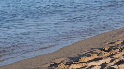 Waves of the coastline on the sandy beach of the Mediterranean Sea. Stock Footage 246257245
