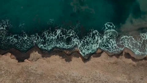Waves colliding with the sand of the sea on the coast Stock-Footage 163737953