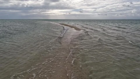 Waves Colliding on Sandbar Part 2 (high angle) Stock Footage 317587697