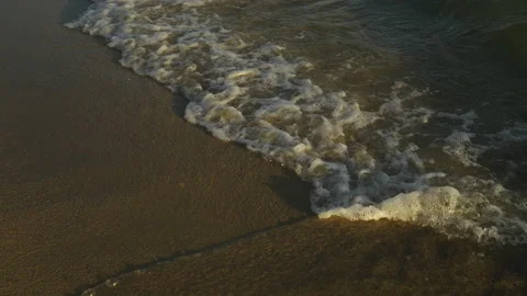 Waves coming onto the pebble beach Video stock 212957908