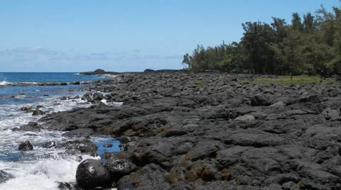 Waves coming into rocks in Hilo Video stock 44917474