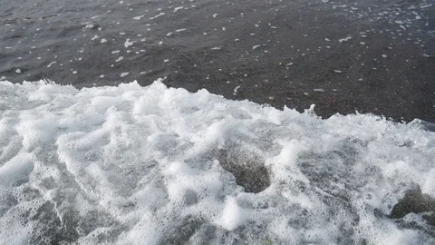 Waves coming into shore on a beach Stock Footage 115470748