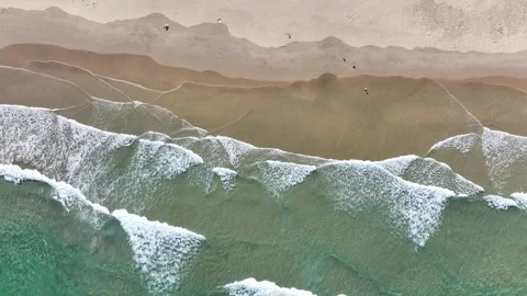 The waves continue to wash over the beach. Fixed camera position. Stock Footage 282238877