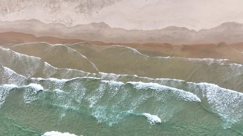 The waves continue to wash over the beach. The screen scrolls horizontally. Stock Footage 282239275