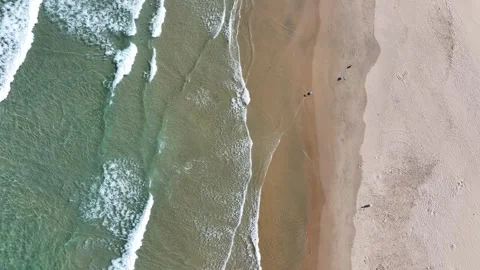 The waves continue to wash over the beach. Stock Footage 282240324