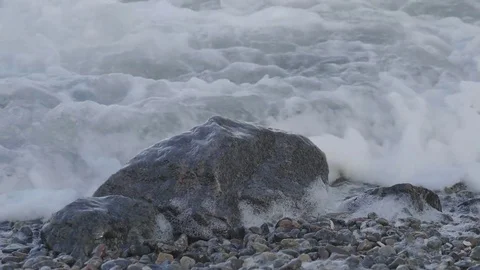 Waves cover the stone with water. Stock Footage 82213529