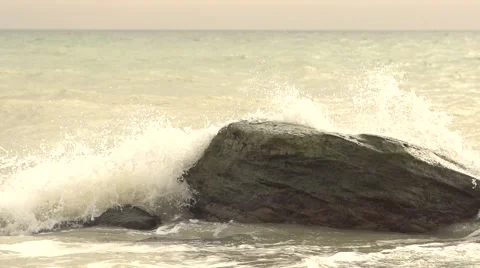 Waves covered rocks. Slow motion. Stock Footage 52670586