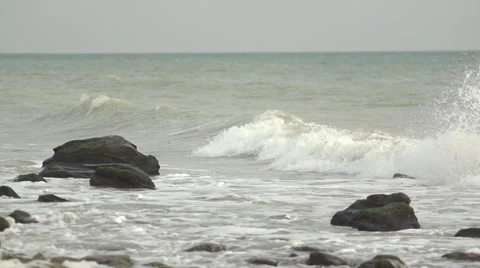 Waves covered rocks. Slow motion. Stock Footage 52670689