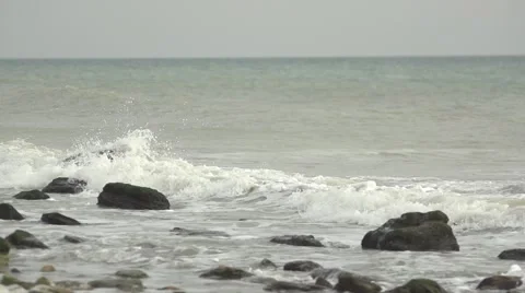 Waves covered rocks. Slow motion. Stock Footage 52670734