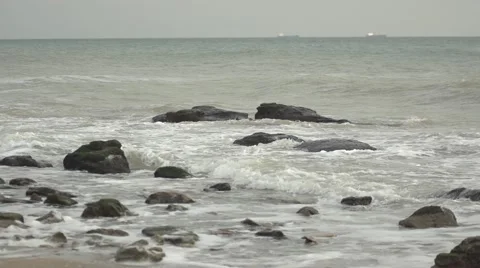 Waves covered rocks. Slow motion. Stock Footage 52670815