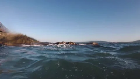 Waves Covering Cliffs in the Sea Stock Footage 247401771