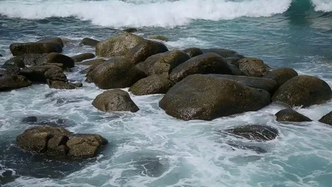 Waves covering the stones Stock Footage 70000274