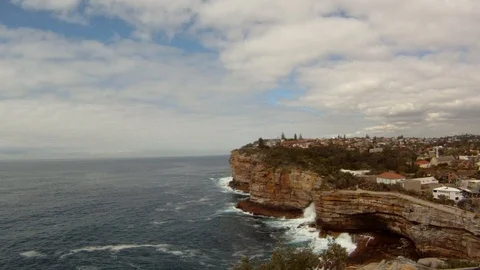 Waves crash against the cliffs in New Zealand Stock Footage 91043570