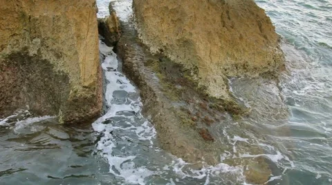 Waves crash against the rock on the sea Stock Footage 44776563