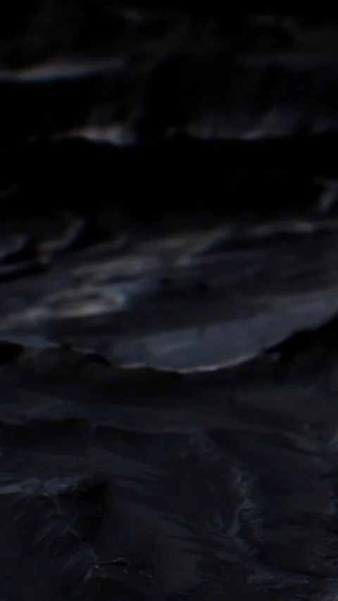 Waves crash against rocky shore under dim light at twilight Stock Footage 344962437