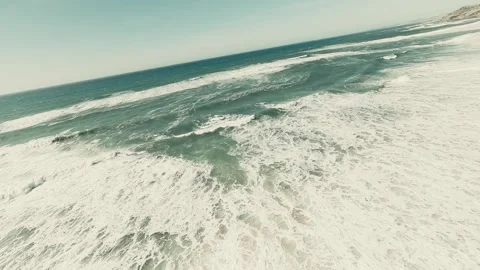 Waves crash against rugged shore with dramatic force Stock Footage 341822938