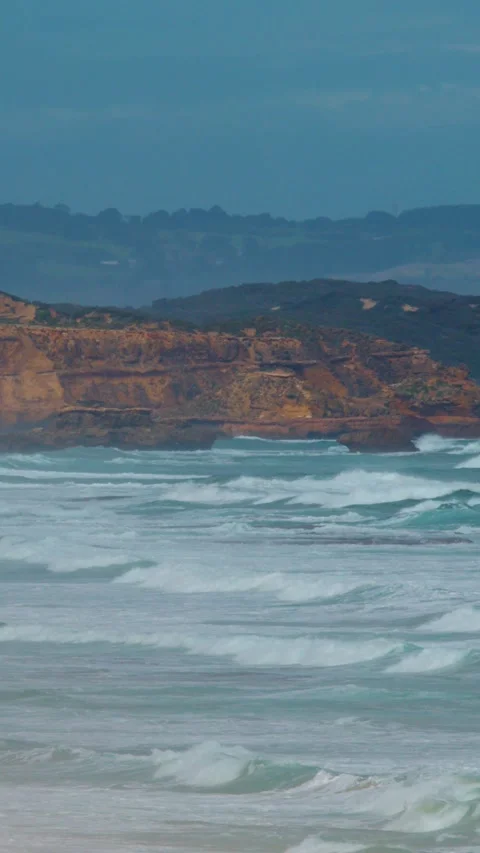 Waves Crash Against Sphinx Rock Limestone Cliffs at Sorrento Stock Footage 316650471