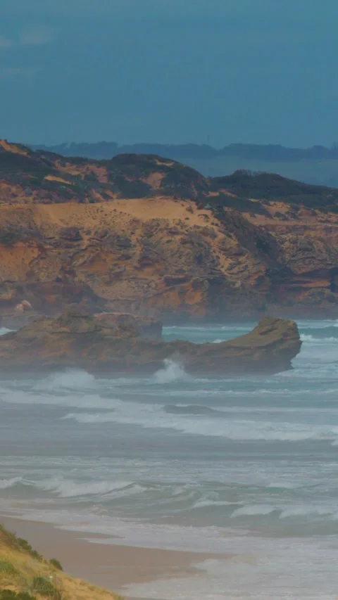Waves Crash Against Sphinx Rock at Sorrento Coastline Stock Footage 316657496