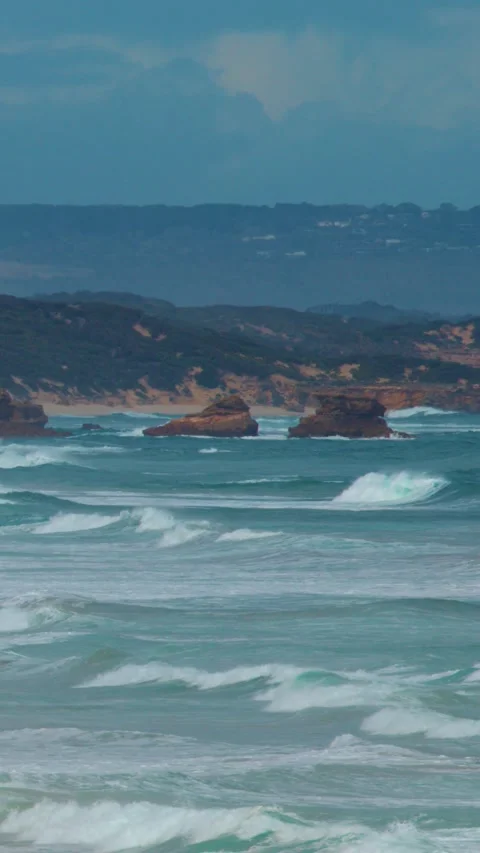 Waves Crash Against Sphinx Rock on Sorrento Coastline Stock Footage 316801629