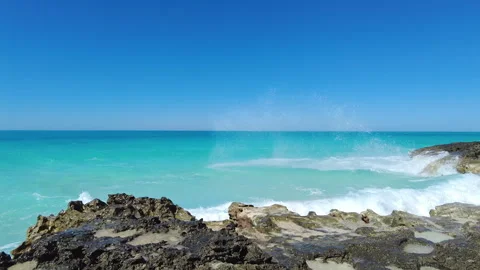 Waves crash along the rocks in the Bimini Islands. Stock Footage 281020096