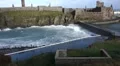 Waves crash around Peel Castle, Isle of Man after hurricane Gonzalo HD Footage