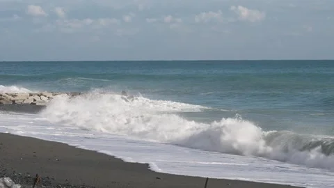 The waves crash onto the beach Stock Footage 276602913