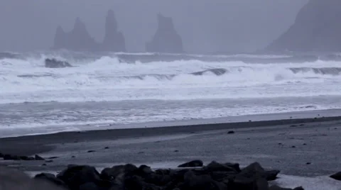 Waves crash into black sand beach Stock Footage 47198177
