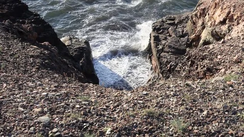 Waves crash into the bottom of a dangerous slide off Stock Footage 83462347
