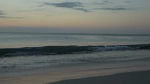 Waves crash at dusk Stock Footage 105872771