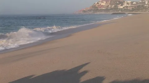 Waves Crash Onto Empty Beach As Sunrises Stock Footage 1012853