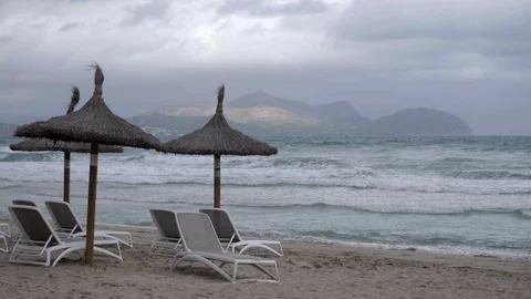 Waves crash on an empty Spanish beach Stock Footage 98571073