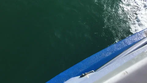 Waves crash at high speed on the side of speedboat. Splashes of turquoise water Video stock 233342003