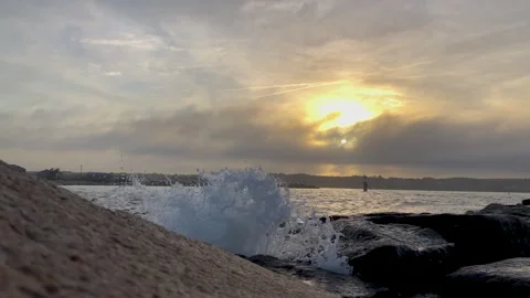 Waves Crash over a Jetty Stock Footage 252149627