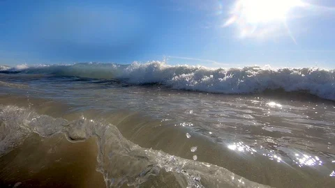 Waves crash over the underwater camera i... Stock Video Pond5