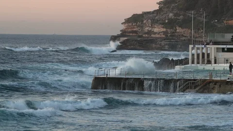 Waves crash on rock pool in slow motion 4K Stock Footage 90885240