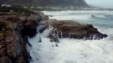 Waves crash into rocks, aerial perspective Stock Footage 90609262